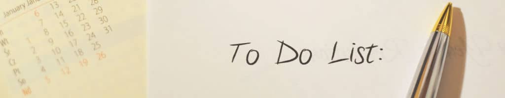 A to do list and calendar with a pen.