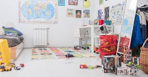 A cluttered kids toy room.