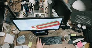 A cluttered desk that needs a good declutter.