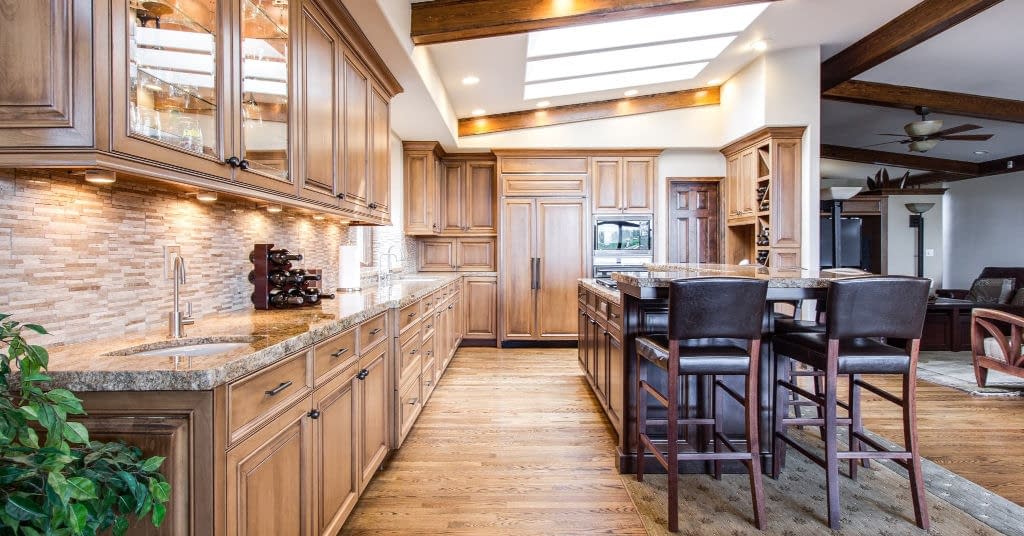 A decluttered classy wood kitchen with lots of clutter storage.