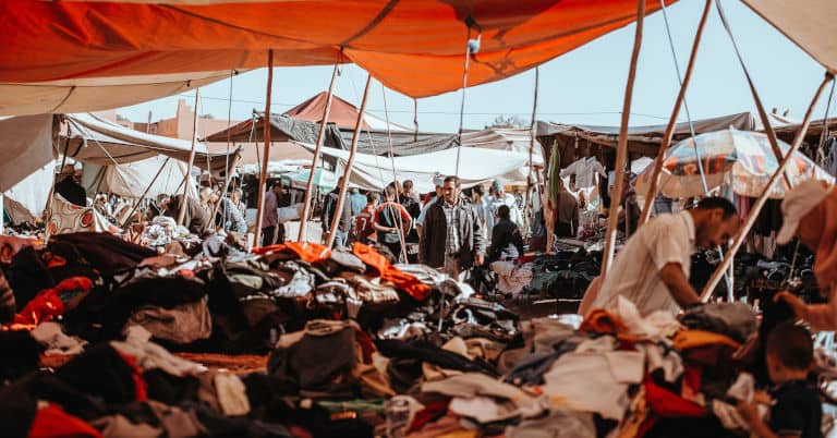 An outdoor used clothes market in Morocco.